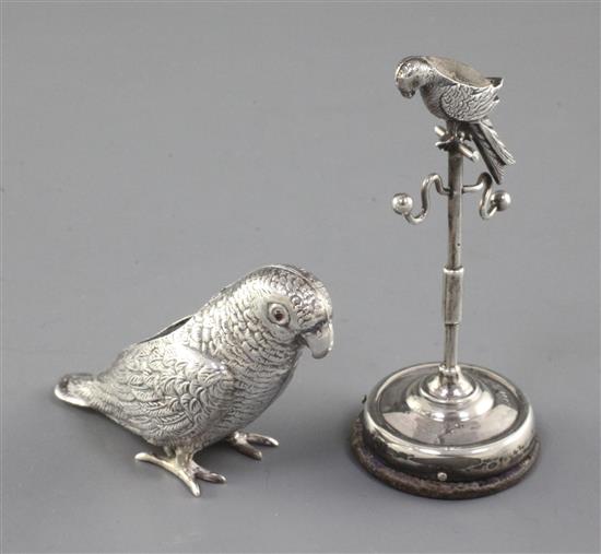 An Edwardian silver mounted combination pin cushion/ring tree and parrot pin cushion.